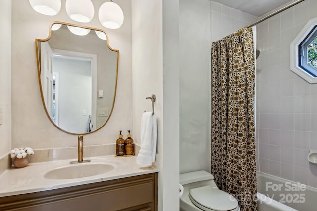 full bath featuring toilet, shower / bathtub combination with curtain, and vanity