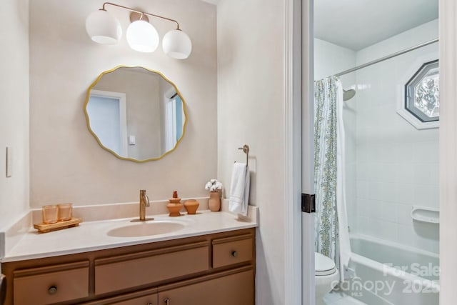 full bath with shower / bath combo, vanity, and toilet