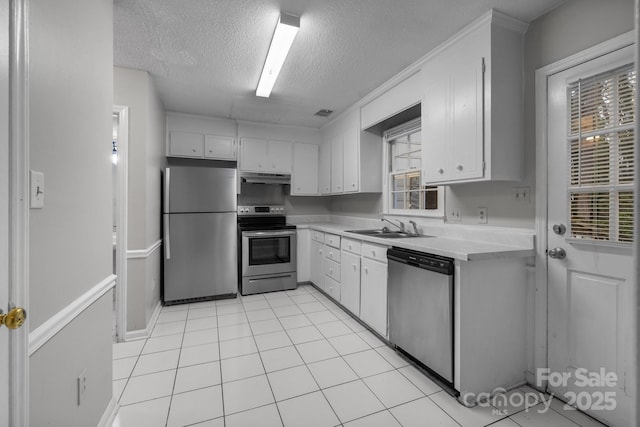 5948 Deveron Dr, Charlotte, NC 28211 - kitchen with light countertops, a sink, white cabinetry, appliances with stainless steel finishes, and under cabinet range hood