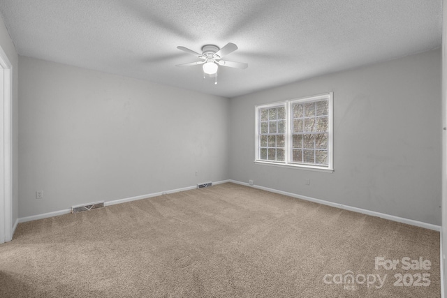 5948 Deveron Dr, Charlotte, NC 28211 - carpeted empty room with baseboards, a textured ceiling, visible vents, and a ceiling fan