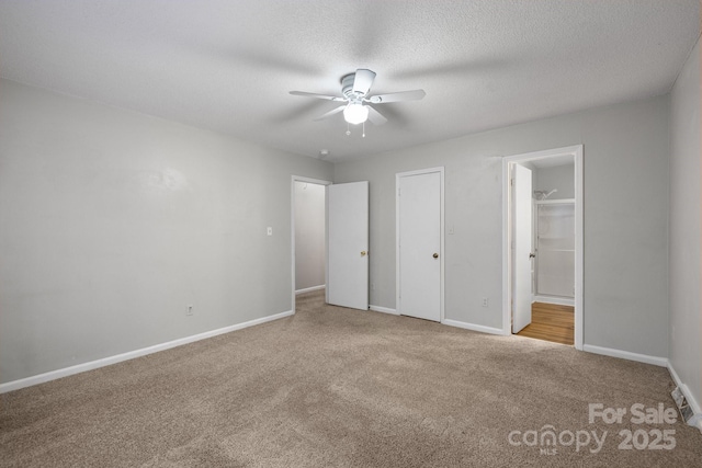 5948 Deveron Dr, Charlotte, NC 28211 - unfurnished bedroom featuring carpet, baseboards, a textured ceiling, ensuite bath, and a ceiling fan