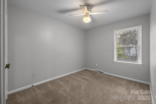 5948 Deveron Dr, Charlotte, NC 28211 - spare room with baseboards, visible vents, carpet flooring, and a ceiling fan