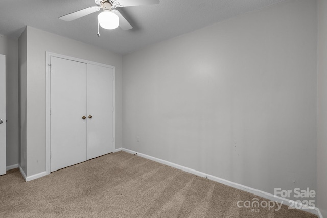 5948 Deveron Dr, Charlotte, NC 28211 - unfurnished bedroom with a ceiling fan, carpet, a closet, and baseboards