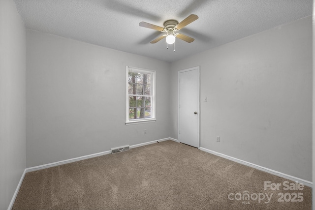 5948 Deveron Dr, Charlotte, NC 28211 - carpeted spare room with baseboards, visible vents, ceiling fan, and a textured ceiling