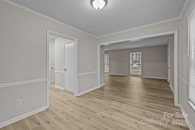 5948 Deveron Dr, Charlotte, NC 28211 - unfurnished room featuring baseboards, a textured ceiling, wood finished floors, and crown molding