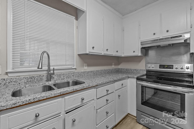 5948 Deveron Dr, Charlotte, NC 28211 - kitchen featuring white cabinetry, a sink, under cabinet range hood, and electric stove