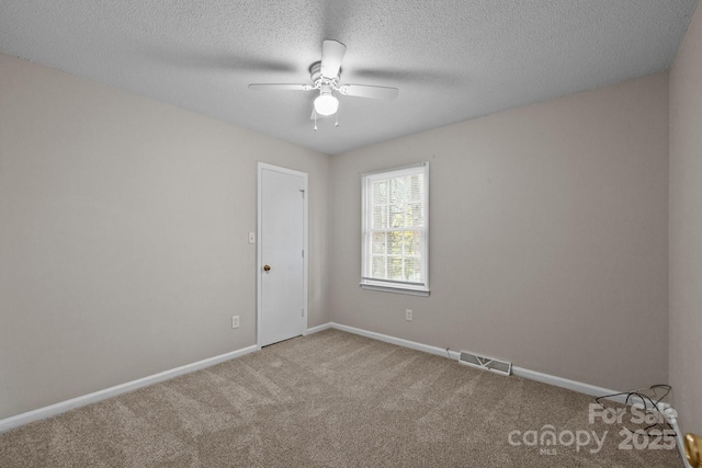 5948 Deveron Dr, Charlotte, NC 28211 - unfurnished room featuring carpet floors, a ceiling fan, a textured ceiling, baseboards, and visible vents