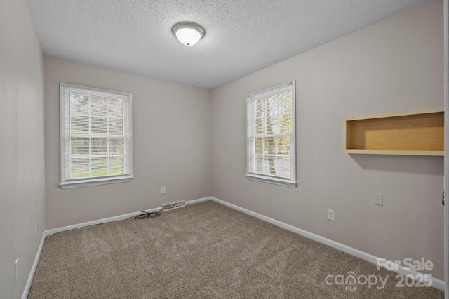 5948 Deveron Dr, Charlotte, NC 28211 - carpeted spare room with visible vents, baseboards, and a textured ceiling