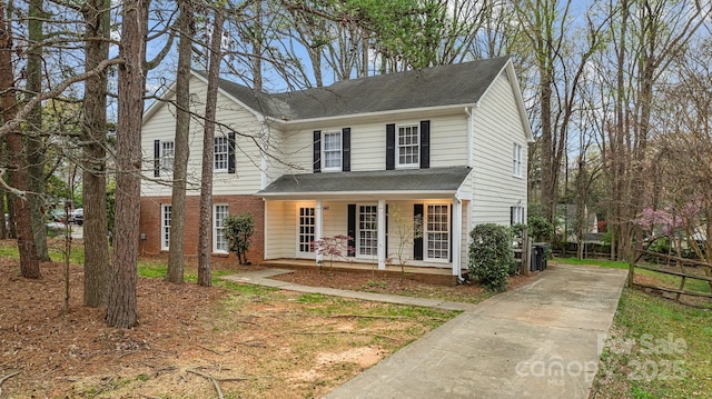 5948 Deveron Dr, Charlotte, NC 28211 - traditional home with covered porch, driveway, and a shingled roof