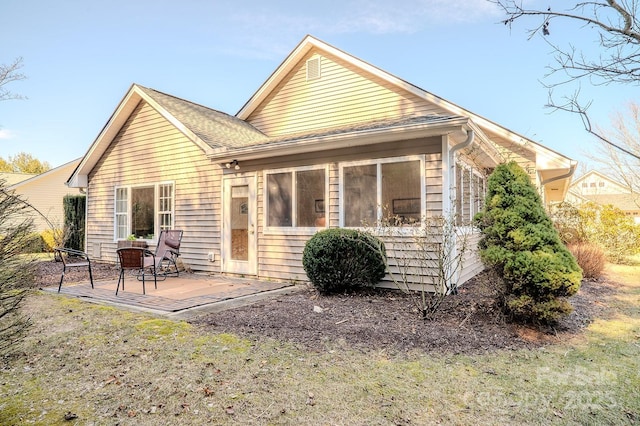 back of property featuring a patio