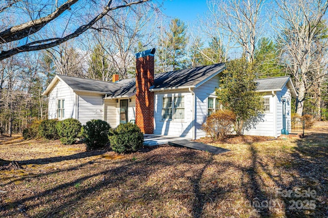 view of front of home with a chimney