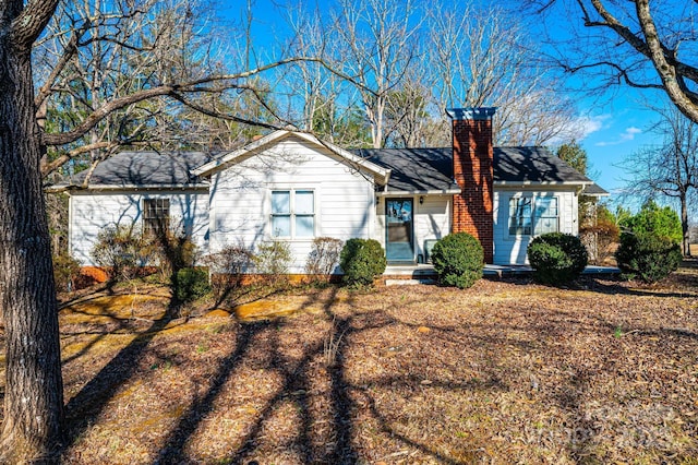 single story home with a chimney