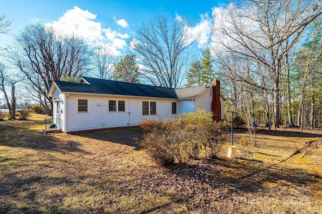 rear view of house with a chimney