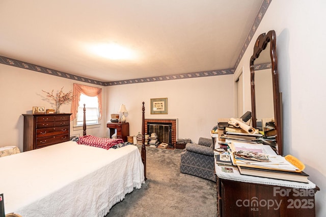 bedroom featuring a brick fireplace and carpet flooring