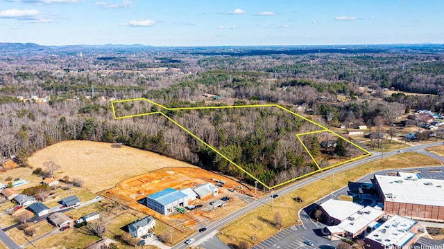 aerial view featuring a wooded view