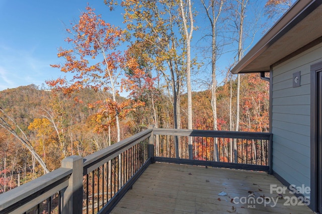 deck featuring a wooded view