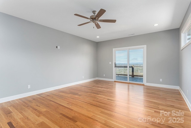 spare room featuring light wood-style floors, recessed lighting, ceiling fan, and baseboards