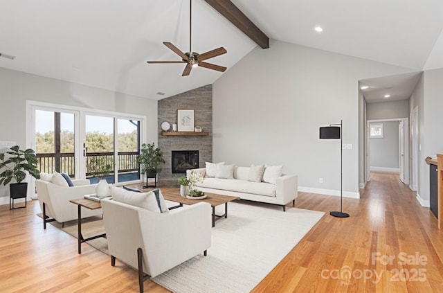 54 Herron View Ln, Weaverville, NC 28787 - living area with a ceiling fan, high vaulted ceiling, a fireplace, light wood-style floors, and beamed ceiling