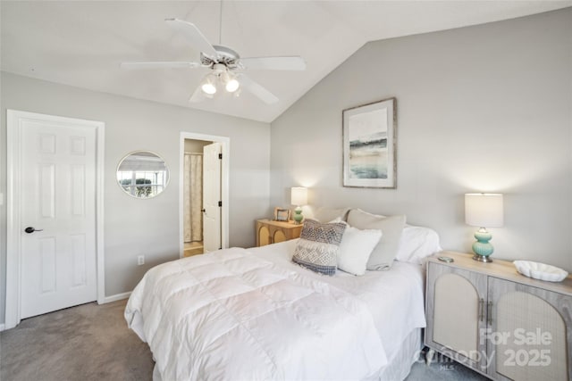 carpeted bedroom with a ceiling fan and vaulted ceiling