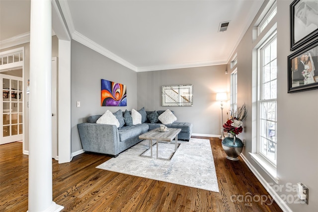 living room featuring baseboards, visible vents, ornamental molding, and dark wood-type flooring