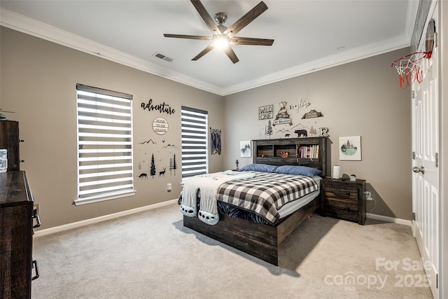 bedroom featuring baseboards, ornamental molding, visible vents, and light colored carpet