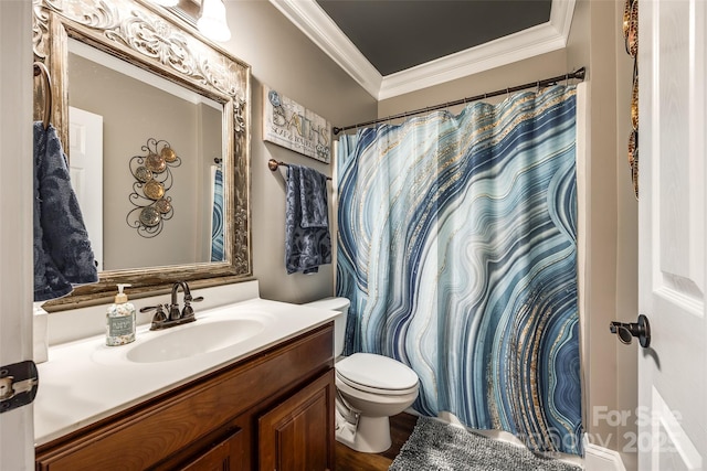 bathroom featuring toilet, ornamental molding, and vanity