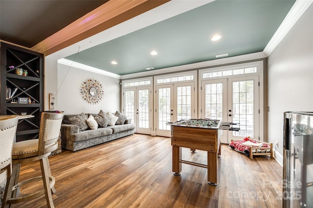 rec room with recessed lighting, french doors, crown molding, and wood finished floors