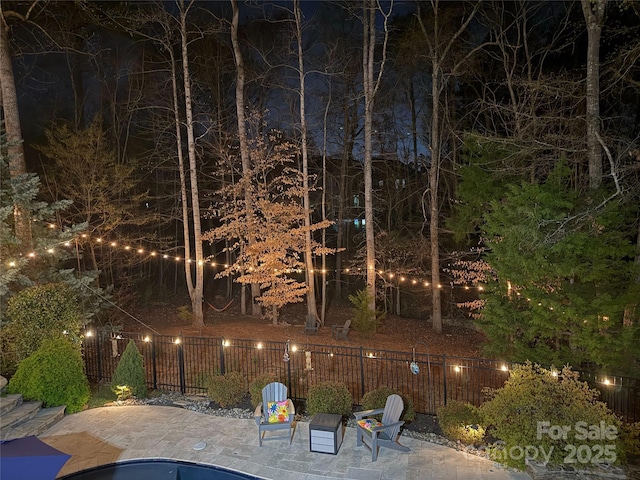 exterior space featuring a patio area and fence