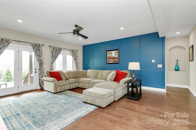 living area with visible vents, baseboards, ceiling fan, recessed lighting, and light wood-style flooring