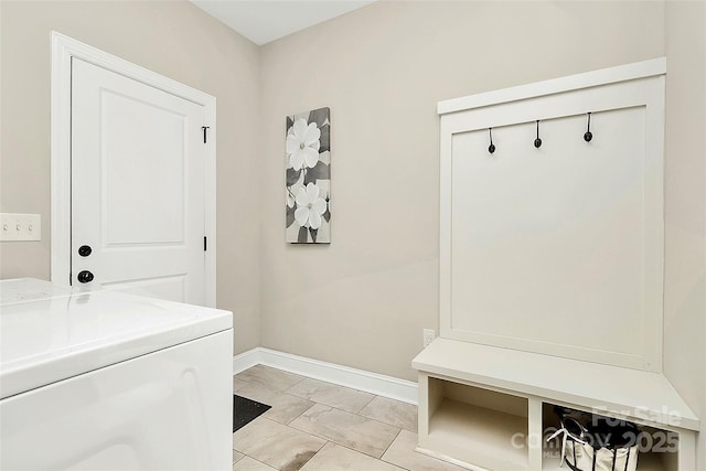 mudroom featuring washer / dryer, marble finish floor, and baseboards