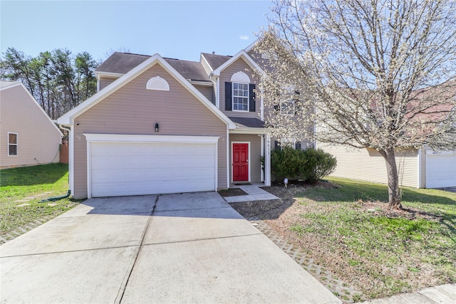 traditional home featuring a garage, concrete driveway, and a front lawn