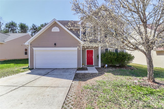 view of front of home featuring a garage, concrete driveway, and a front yard