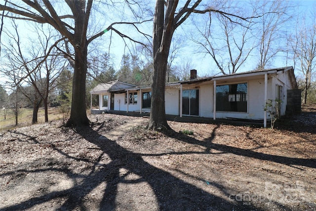 exterior space featuring stucco siding