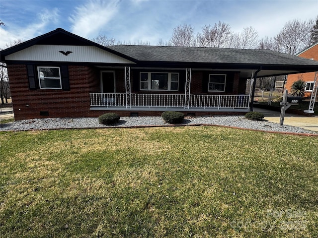 ranch-style house with an attached carport, crawl space, brick siding, and a front yard