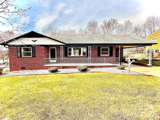 ranch-style house featuring brick siding, concrete driveway, a front yard, crawl space, and a carport