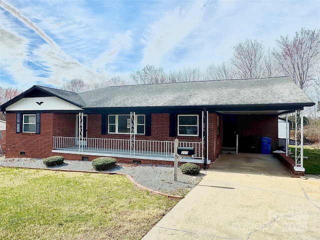 ranch-style home with concrete driveway, brick siding, crawl space, and a front yard