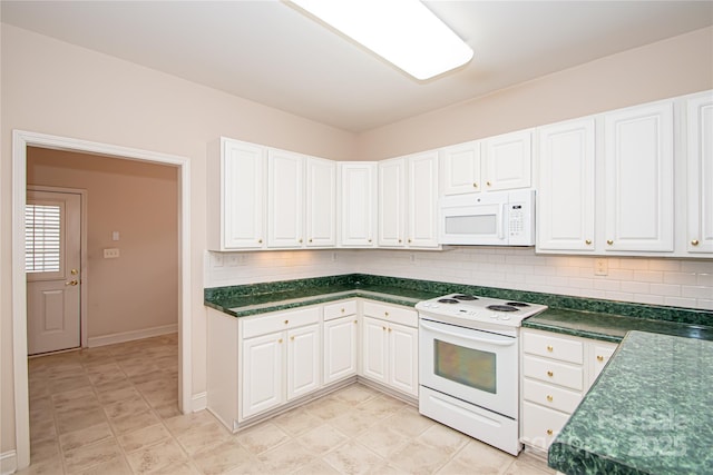 kitchen with white appliances, dark countertops, and decorative backsplash