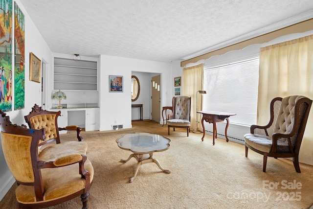 living area with visible vents, carpet flooring, a textured ceiling, and baseboard heating