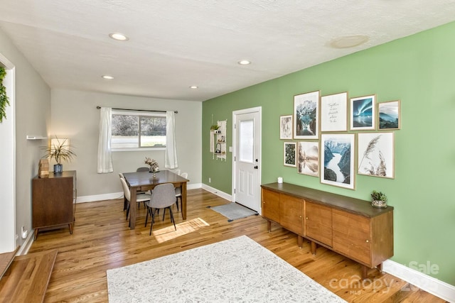 dining room featuring recessed lighting, light wood-style flooring, and baseboards