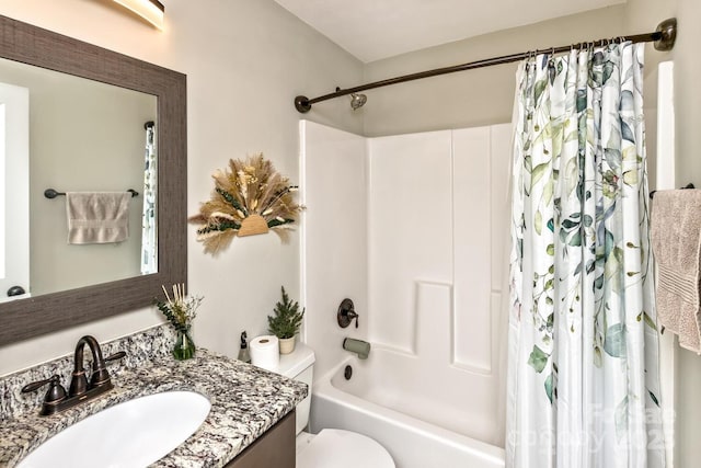 bathroom with toilet, shower / bath combo with shower curtain, and vanity