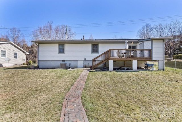 back of property with central AC, fence, a yard, stairway, and a wooden deck