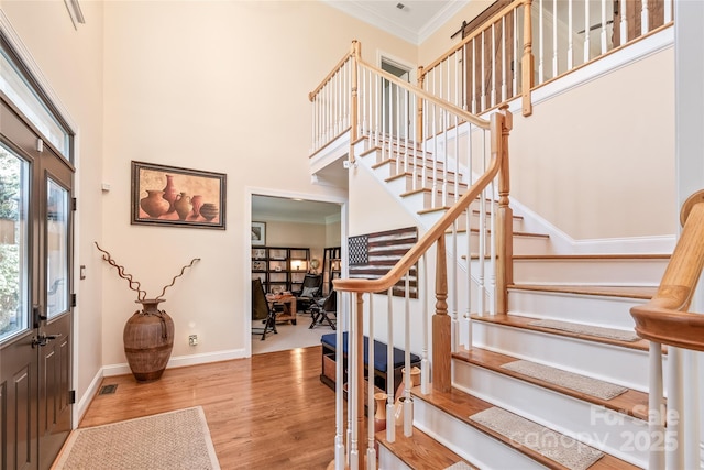5101 Belicourt Dr, Charlotte, NC 28277 - entrance foyer featuring visible vents, a towering ceiling, ornamental molding, wood finished floors, and baseboards