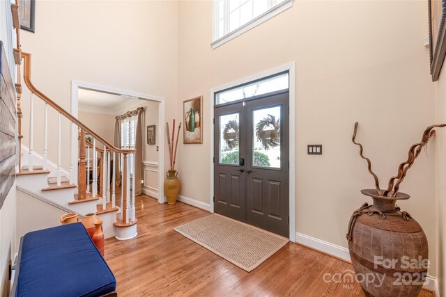 5101 Belicourt Dr, Charlotte, NC 28277 - foyer featuring a wealth of natural light, baseboards, stairway, and light wood finished floors