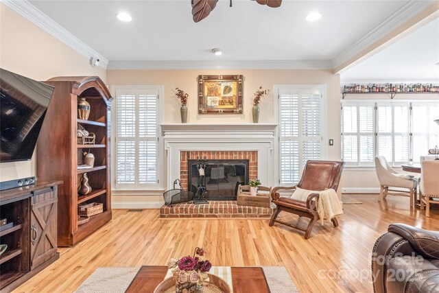5101 Belicourt Dr, Charlotte, NC 28277 - living area featuring a fireplace, wood finished floors, a ceiling fan, and crown molding