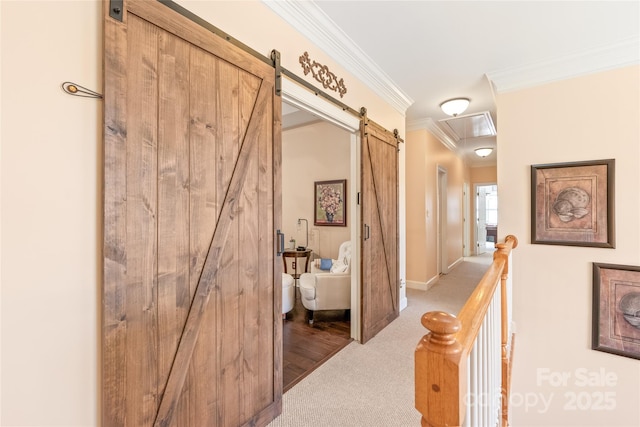 5101 Belicourt Dr, Charlotte, NC 28277 - hall with a barn door, baseboards, an upstairs landing, crown molding, and carpet flooring