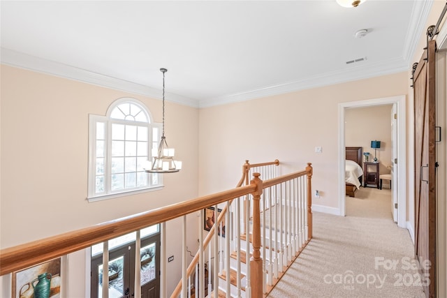 5101 Belicourt Dr, Charlotte, NC 28277 - hallway featuring a barn door, visible vents, light colored carpet, an inviting chandelier, and an upstairs landing