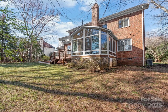 5101 Belicourt Dr, Charlotte, NC 28277 - rear view of house with brick siding, a sunroom, a lawn, crawl space, and a chimney