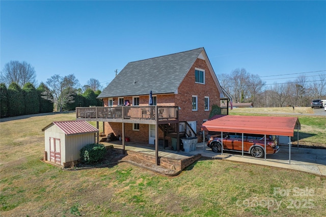 rear view of property with a deck, a storage shed, an outdoor structure, stairs, and a lawn