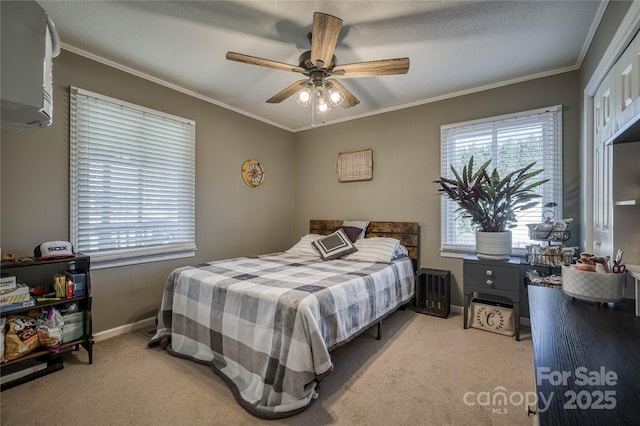 bedroom with carpet floors, multiple windows, and ornamental molding