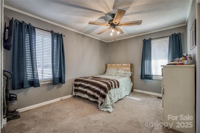 carpeted bedroom with crown molding, a textured ceiling, baseboards, and ceiling fan